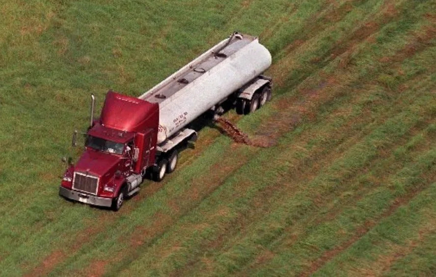 A truck dumps human sludge on a pasture in a ranch near Okeechobee in this photo from September 2000.