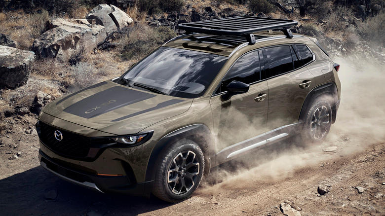 2025 Mazda CX-50 driving through sand