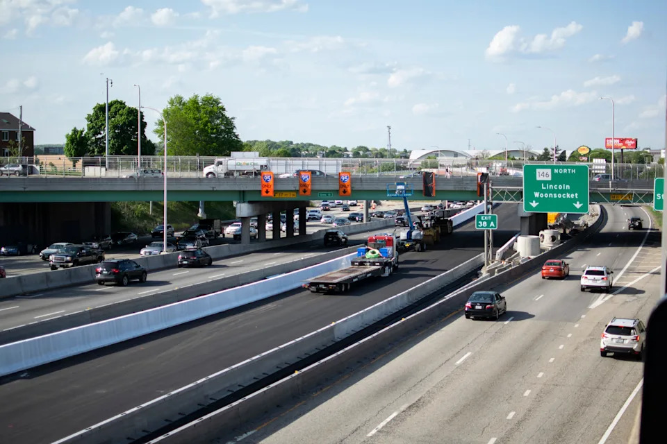 Rhode Island law requires drivers to stay in the right lane except when passing another vehicle, when the right lane is closed, on a roadway with three marked traffic lanes, or on a roadway designated for one-way traffic.