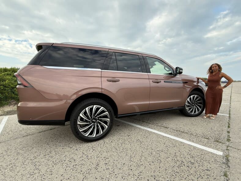 Kim Smith standing next to the Lincoln Navigator Black Label