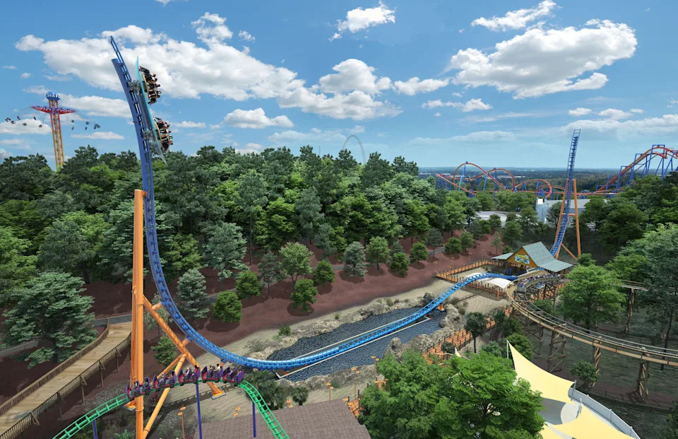 FILE - Six Flags Over Georgia guests ride the Georgia Surfer. Six Flags recently canceled its annual "Holiday in the Park" event.