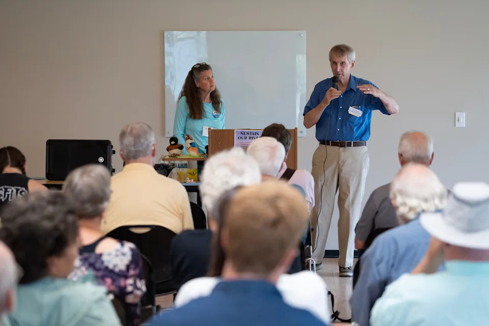 Lee Donahue and Marc Schultz address community members during the Sustain our River event, before opening up the Q&A at Black River Beach House in La Crosse on the morning of Aug. 4, 2025.