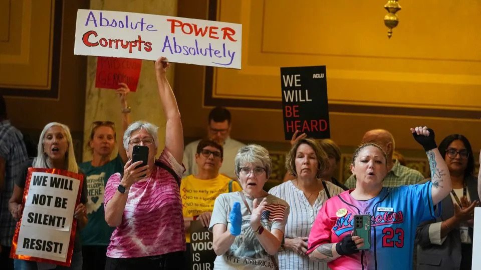 People rally in opposition to redistricting at the Indiana Statehouse in Indianapolis on Thursday. - Michael Conroy/AP