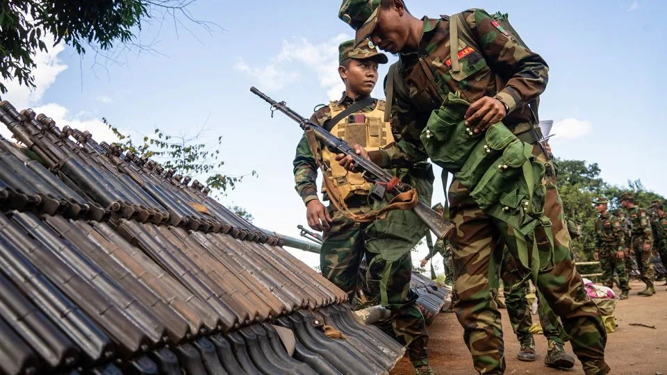 Members of Ta'ang National Liberation Army (TNLA) receive military equipment after getting special combat training in a secret jungle near Namhkam, Myanmar's northern Shan State on November 9, 2024. - Stringer/AFP/Getty Images