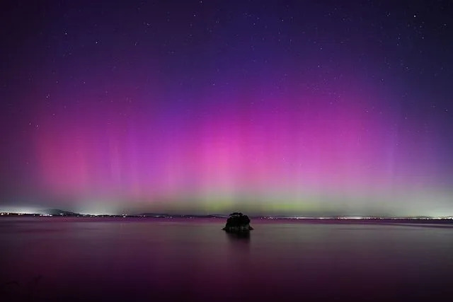 Tayfun Coskun/Anadolu via Getty CALIFORNIA, USA - MAY 11: Northern Lights (Aurora Borealis) illuminate the sky of San Francisco North Bay as seen from China Camp Beach in San Rafael, California, United States on May 11, 2024
