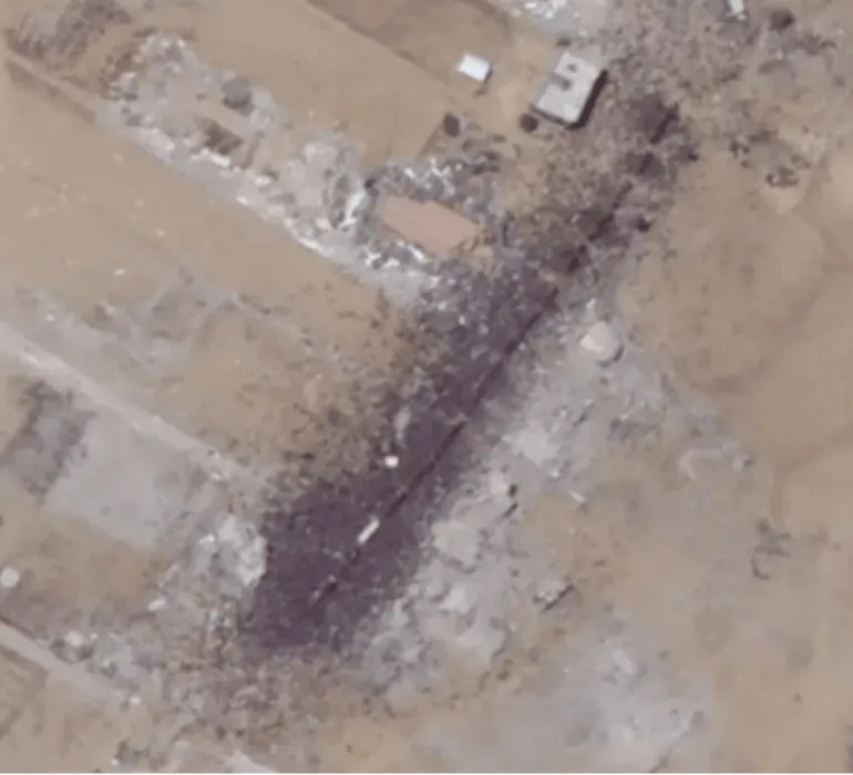Satellite image from July 26, 2025, showing crowds of Palestinians and aid trucks in Khan Younis [Planet Labs PBC]