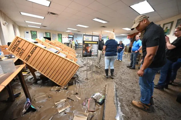  Gov. Wes Moore (D) inspects damage at a Westernport libary on May 15, 2025, in the wake of the floods there. (Photo by Patrick Siebert/Governor’s office)