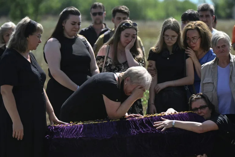 'Back home': family who fled front buried after Kyiv strike