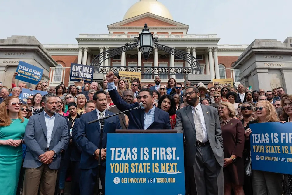 Surrounded by Democratic state representatives from all over the country, state Rep. Armando Walle, D-Houston, speaks at a press conference on the front steps of the Massachusetts State House in Boston on the 60th anniversary of the Voting Rights Act, on Wednesday, August 6, 2025.