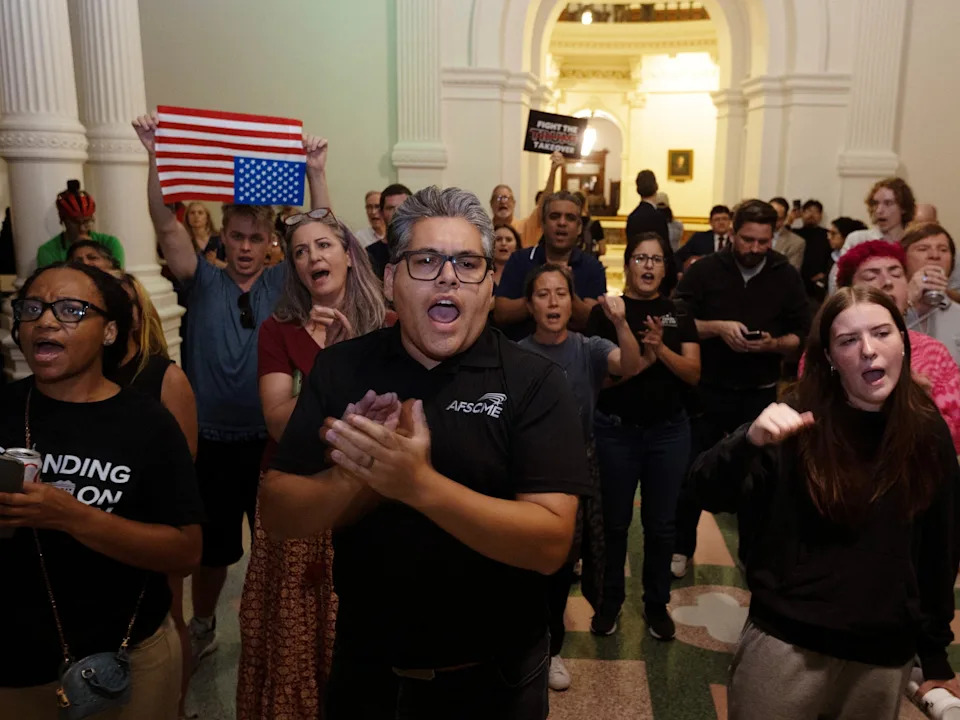 Nuri Vallbona/Reuters - PHOTO: Protesters cheer on Texas State Representative Nicole Collier after she chose to remain in the Texas House chamber at the State Capitol in Austin, Texas, August 18, 2025.
