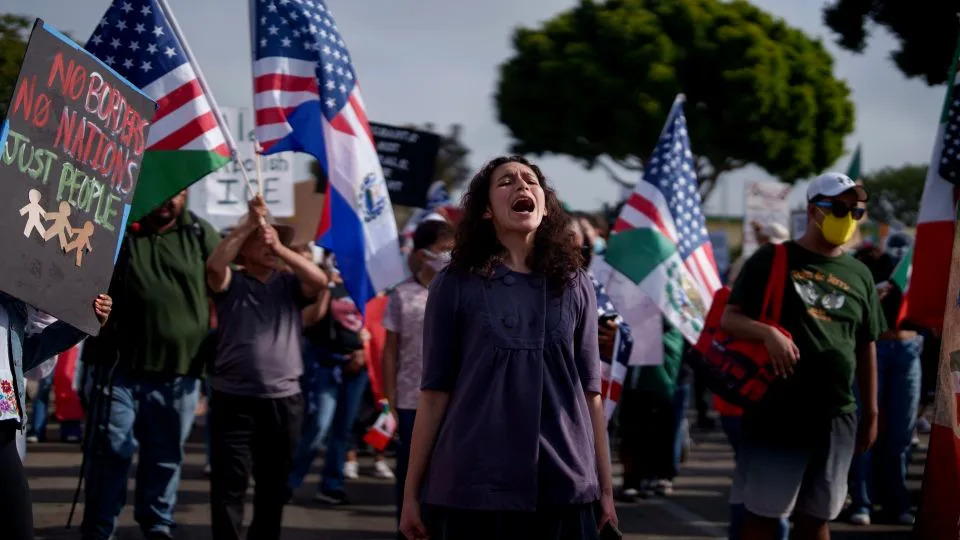 People attend a rally and march in Oxnard, California, on July 11 after around 200 people were detained by federal officers during a raid at a cannabis farm in nearby Camarillo. - Eric Thayer/Getty Images