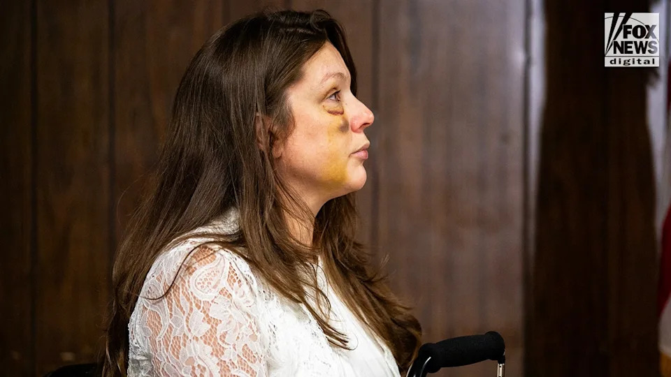 Holly, a victim in the viral July 26 brawl in Cincinnati, listens as Sen. Bernie Moreno speaks