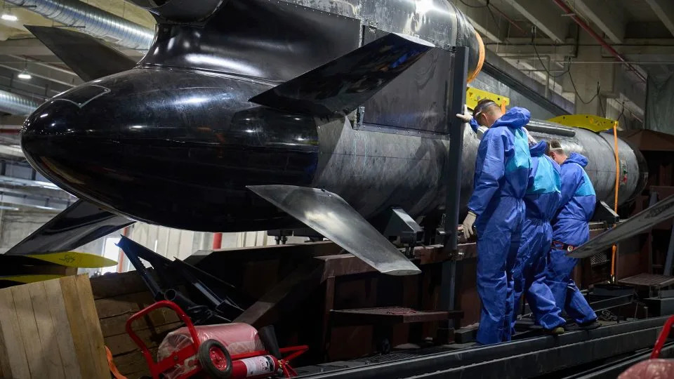 Workers inspect a Flamingo cruise missile at Fire Point's secret factory in Ukraine on August 18, 2025. - Efrem Lukatsky/AP