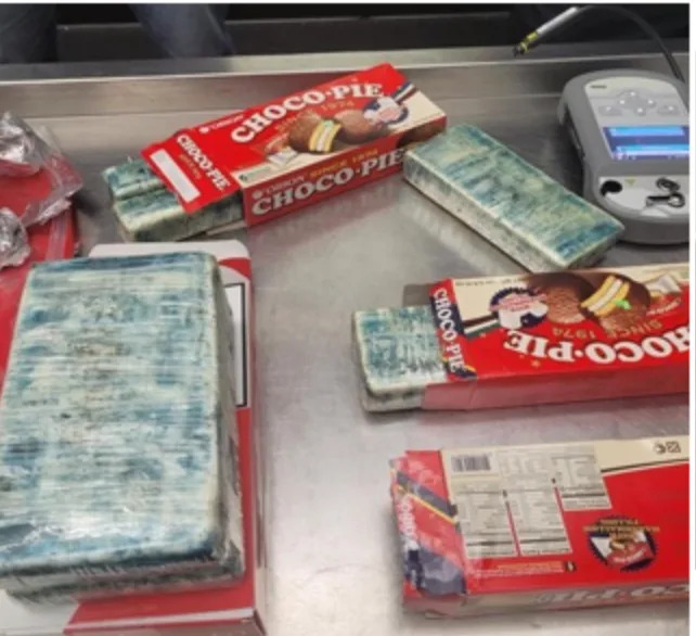 U.S. embassy worker smuggled cocaine in cigarettes, sweets, DOJ says