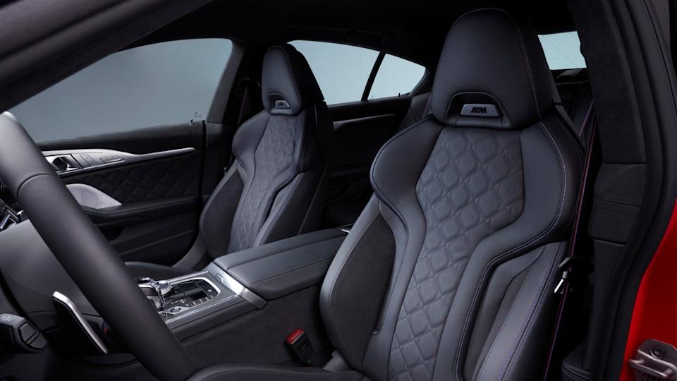 interior view from driver side showing quilted leather front seats with integrated headrests and center console.
