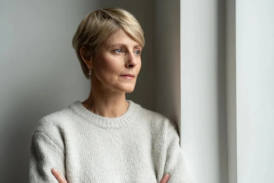 Woman looking sad and thoughtful.