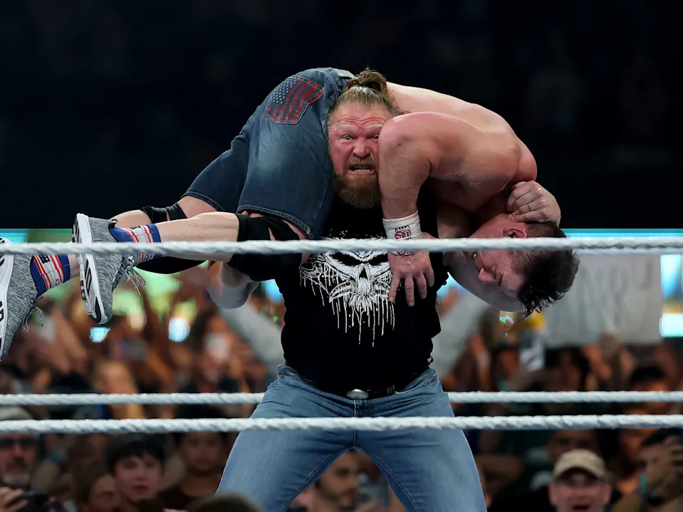 EAST RUTHERFORD, NEW JERSEY - AUGUST 03: Brock Lesnar throws John Cena during the WWE 2025 SummerSlam at MetLife Stadium on August 03, 2025 in East Rutherford, New Jersey. (Photo by Elsa/Getty Images)