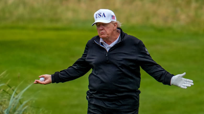 President Donald Trump reacts as he plays a round of golf at Trump Turnberry golf course during his visit to the UK on July 27, 2025 in Turnberry, Scotland.