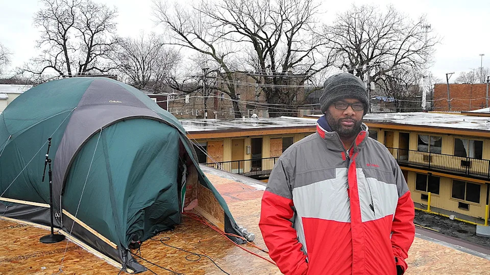 Pastor Corey Brooks on the roof of an abandoned motel on Chicago's South Side to protest neighborhood violence and raise funds for a community center