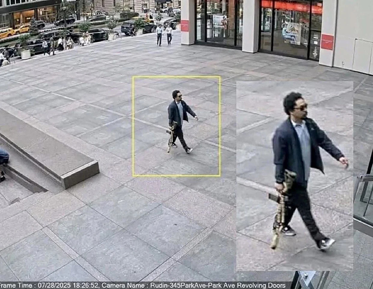 <span>Shane Tamura walks into an office building in Manhattan shortly before the shooting, on 28 July 2025, in a still image taken from surveillance video.</span><span>Photograph: Reuters</span>