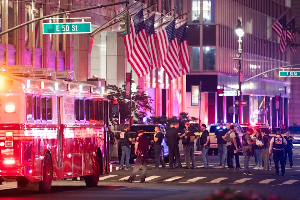 Police officers gather in a street as they respond to a shooting incident in the Midtown Manhattan neighborhood of New York on July 28, 2025 in New York City.