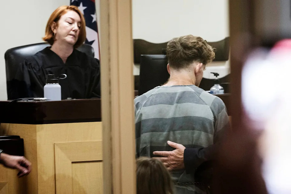 Teacher accused of killing parents on hike pleads not guilty to murder charges