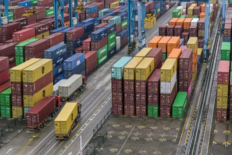 China's economy is facing headwinds, with sluggish domestic consumption and tariff challenges for its exports (Hector RETAMAL)