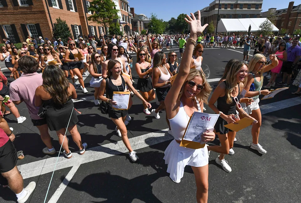 Seventeen sororities welcomed new members on the University of Alabama Panhellenic Association Bid Day Sunday, Aug. 18, 2024. Phi Mu’s new members walk to their house after receiving their bids in Bryant-Denny Stadium.