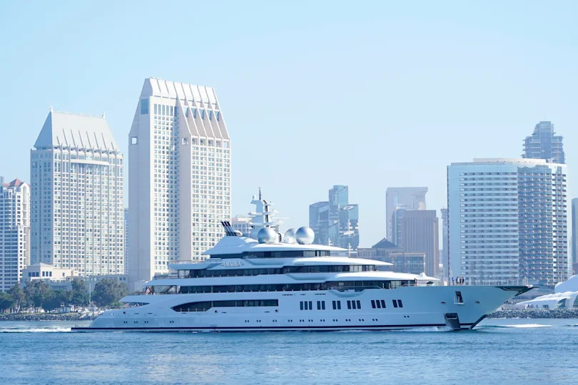 File: The super yacht Amadea passes San Diego as it comes into the San Diego Bay Monday, June 27, 2022, seen from Coronado, Calif. The $325 million superyacht seized by the United States from a sanctioned Russian oligarch arrived in San Diego Bay on Monday. / Credit: Gregory Bull / AP