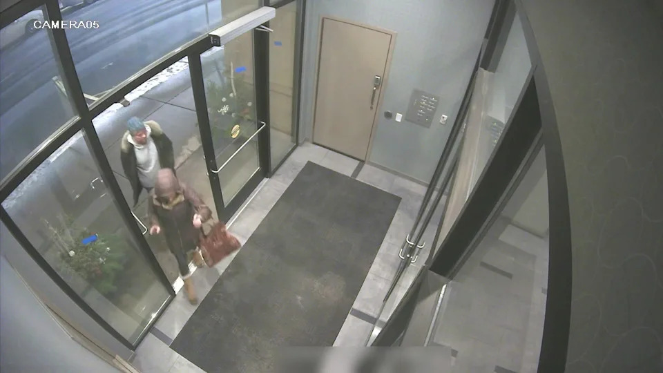 Surveillance video from 2:05 a.m. on Dec. 16, 2022, shows Alex Pennig and Matthew Ecker as they arrive at her apartment building after walking there from Camp Bar. / Credit: Ramsey County District Court