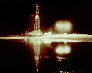 The Clarence Iverson Well #1 on April 4, 1951, its first night of operation. The well was the first in North Dakota to produce oil. Clarence Iverson was a relative of Diana Skarphol. (William Shemorry, courtesy of State Historical Society of North Dakota. SHSND 10958-0059-00001)