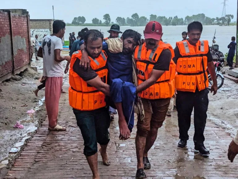Pakistan evacuates thousands as India releases water from swollen rivers