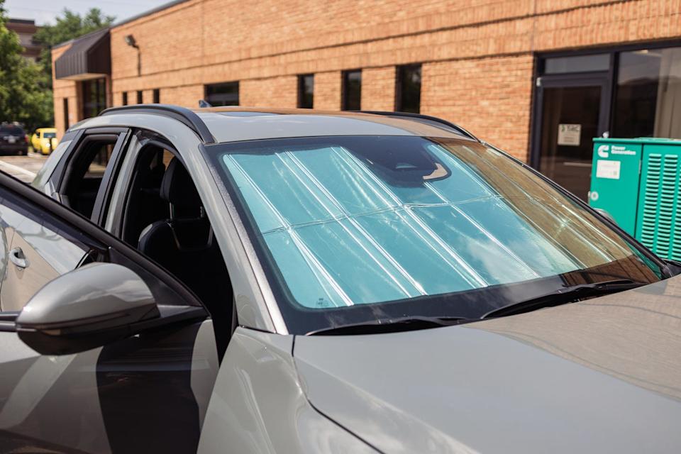 a truck with a car sun shade installed