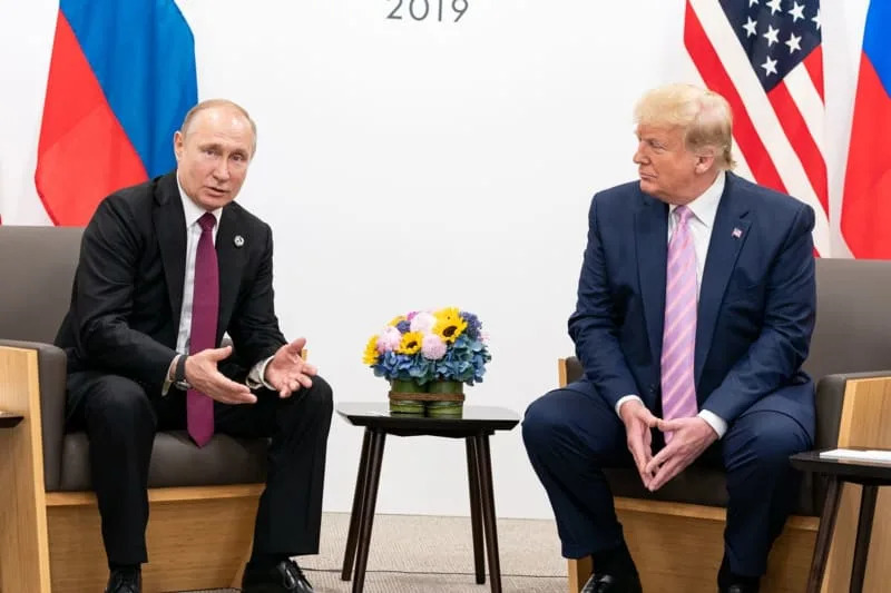 US President Donald Trump (R) shakes hands with Russian President Vladimir Putin during their meeting on the sidelines of the 2019 G20 summit. -/White House/dpa