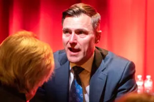 Oregon Attorney General Dan Rayfield speaks to an attendee at a town hall in Phoenix, Arizona on March 5, 2025. (Photo by Jerod MacDonald-Evoy/Arizona Mirror)