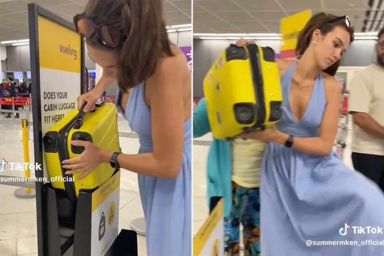 Woman checking if her yellow suitcase fits within airline size restrictions.