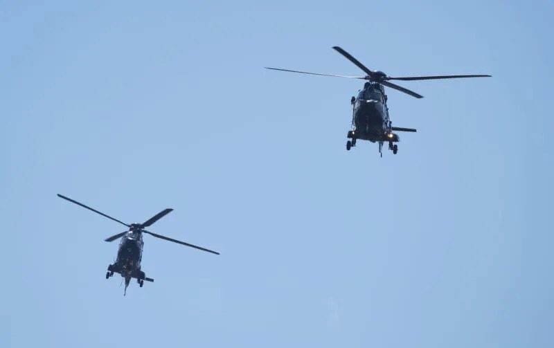 Tow German police helicopters land in front of the Chancellery ahead of Ukrainian President Zelensky's participation in virtual consultations of European heads of state and government in view of the meeting between US President Trump and Russian President Putin. Sören Stache/dpa