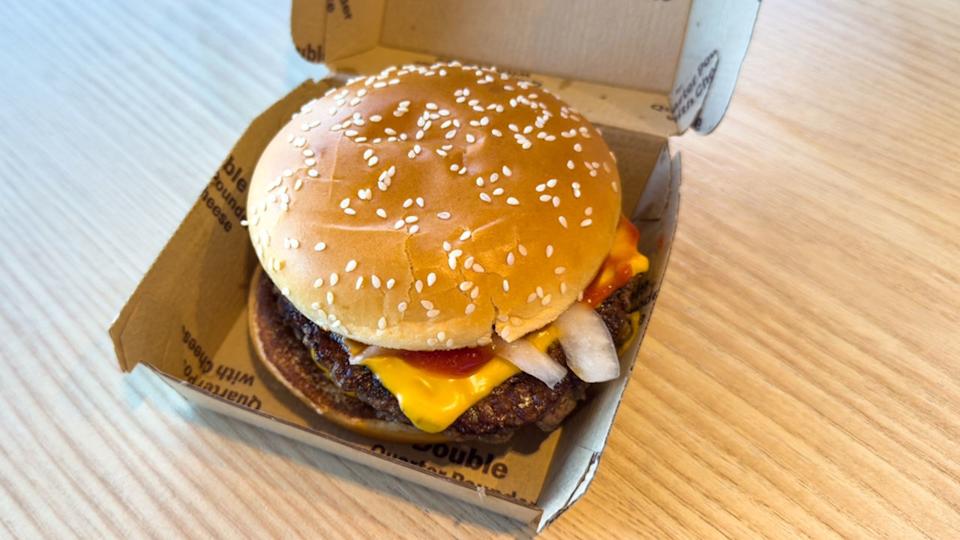 Closeup of Double Quarter Pounder with Cheese in a cardboard box from McDonalds fast food restaurant.