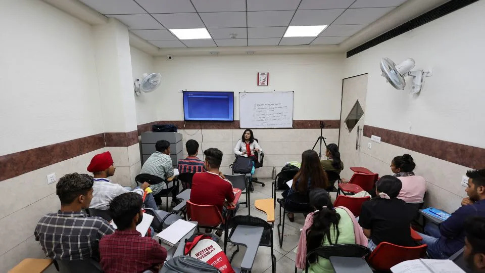 Students attend an International English Language Testing System class in Ambala, Haryana, India, in August 2022. - Anushree Fadnavis/Reuters