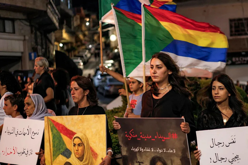 Members of the Druze community in the Israel-annexed Golan Heights gather for a rally