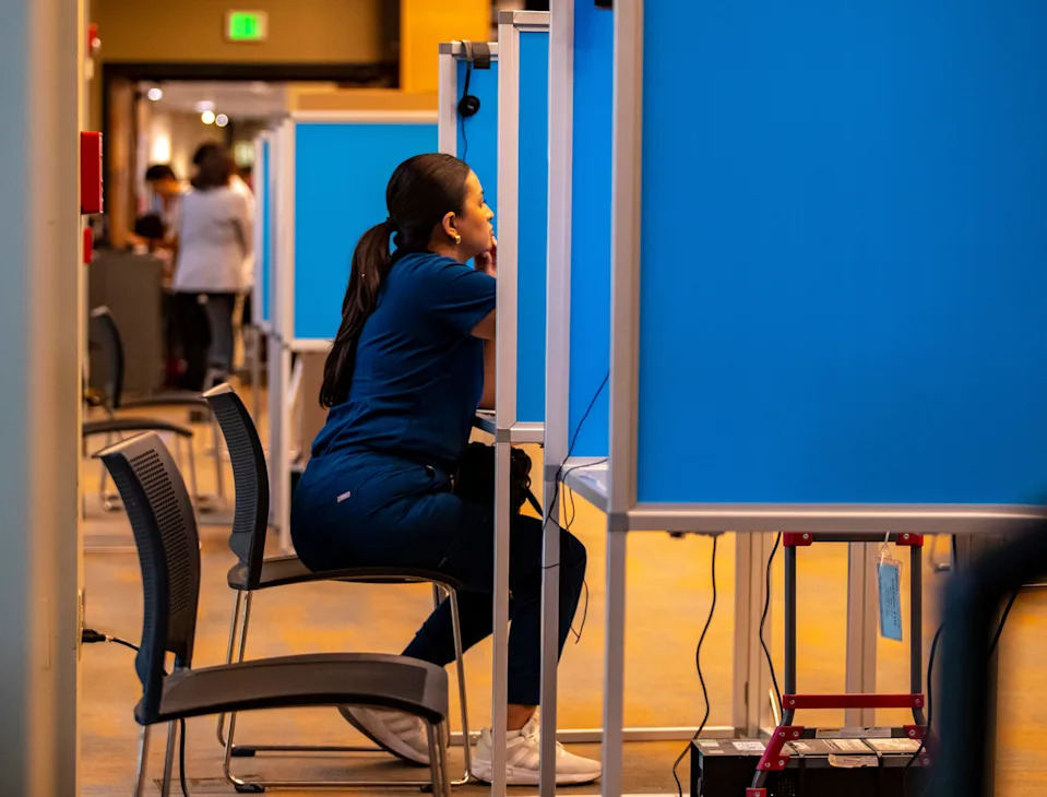 Yadira Orozco of Rancho Mirage sits down to vote for the first time after recently becoming a citizen at the Rancho Mirage Public Library in Rancho Mirage, Calif., Tuesday, Nov. 5, 2024.