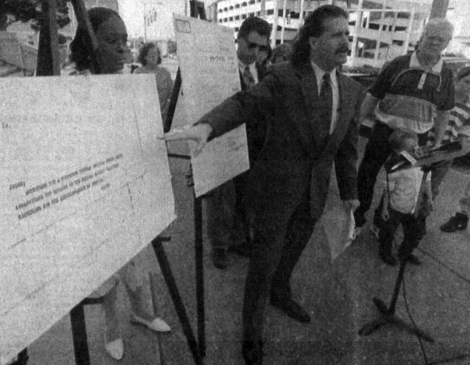 From 1996, Montgomery lawyer William Gill points to the type on a document that he said did not match a letter that federal authorities used as a basis to investigate Robert Wayne O'Ferrell, right, of New Brockton for a pair of 1989 mail bomb deaths.