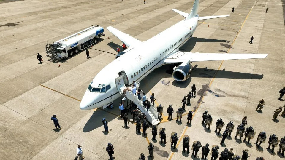 Venezuelan detainees are shown being sent home in a prison exchange for Americans held in Venezuela, according to El Salvador President Nayib Bukele, at El Salvador International Airport in San Luis Talpa, El Salvador, in this handout picture obtained by Reuters on July 18, 2025. - El Salvador Government/Reuters/File