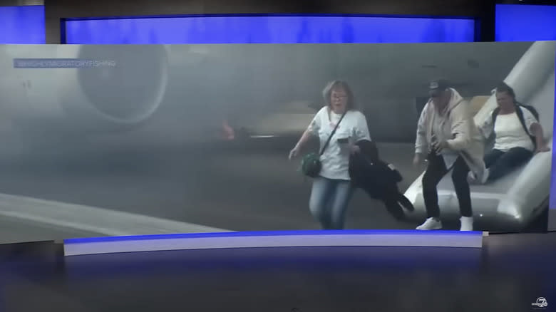 passengers evacuating american airlines flight in denver