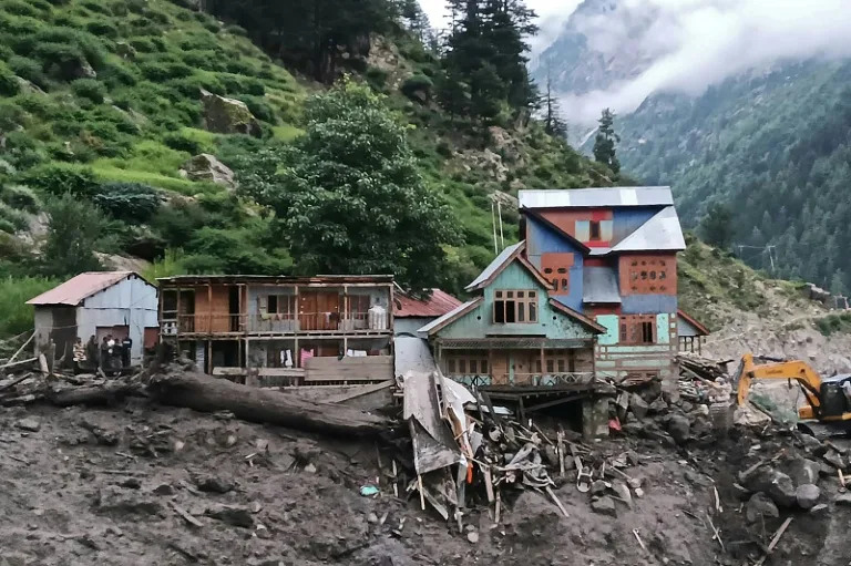 Indian rescuers scour debris after 60 killed in flood