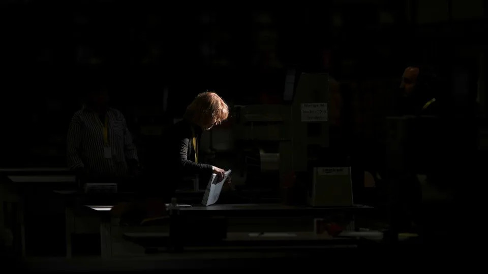 An election worker processes mail-in ballots for the 2024 election in Philadelphia on November 5, 2024. - Matt Slocum/AP