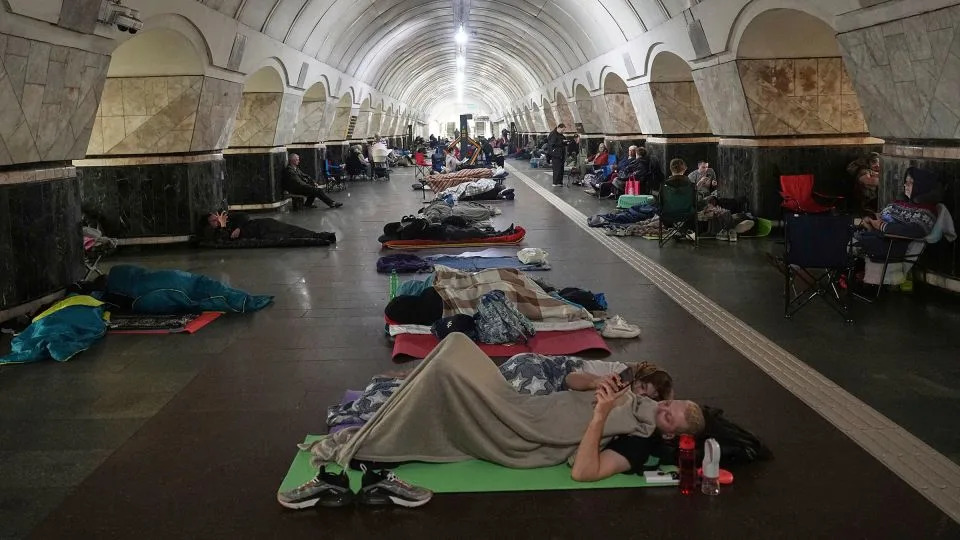 People rest in a metro station, being used as a bomb shelter, during a Russian attack in Kyiv, Ukraine, early on  July 10. - Efrem Lukatsky/AP