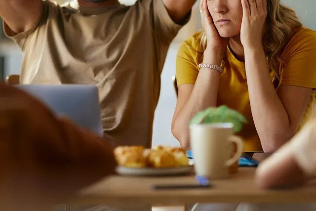 Getty Stock photo of a woman upset at a table