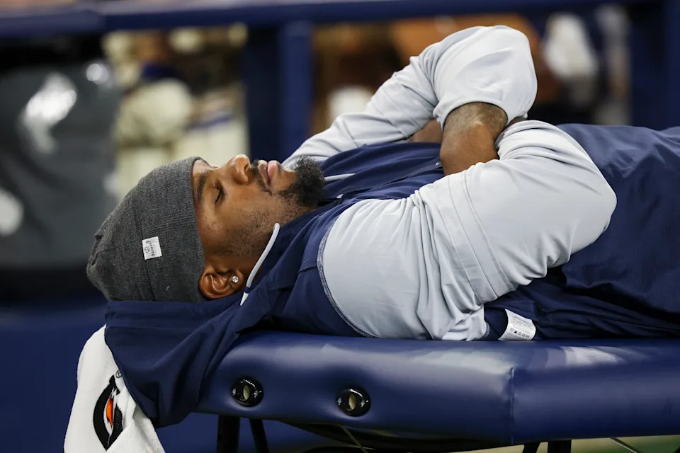 Dallas Cowboys defensive end Micah Parsons lies on the medical table during the second half of a preseason NFL football game against the Atlanta Falcons Friday, Aug. 22, 2025, in Arlington, Texas. (AP Photo/Gareth Patterson)