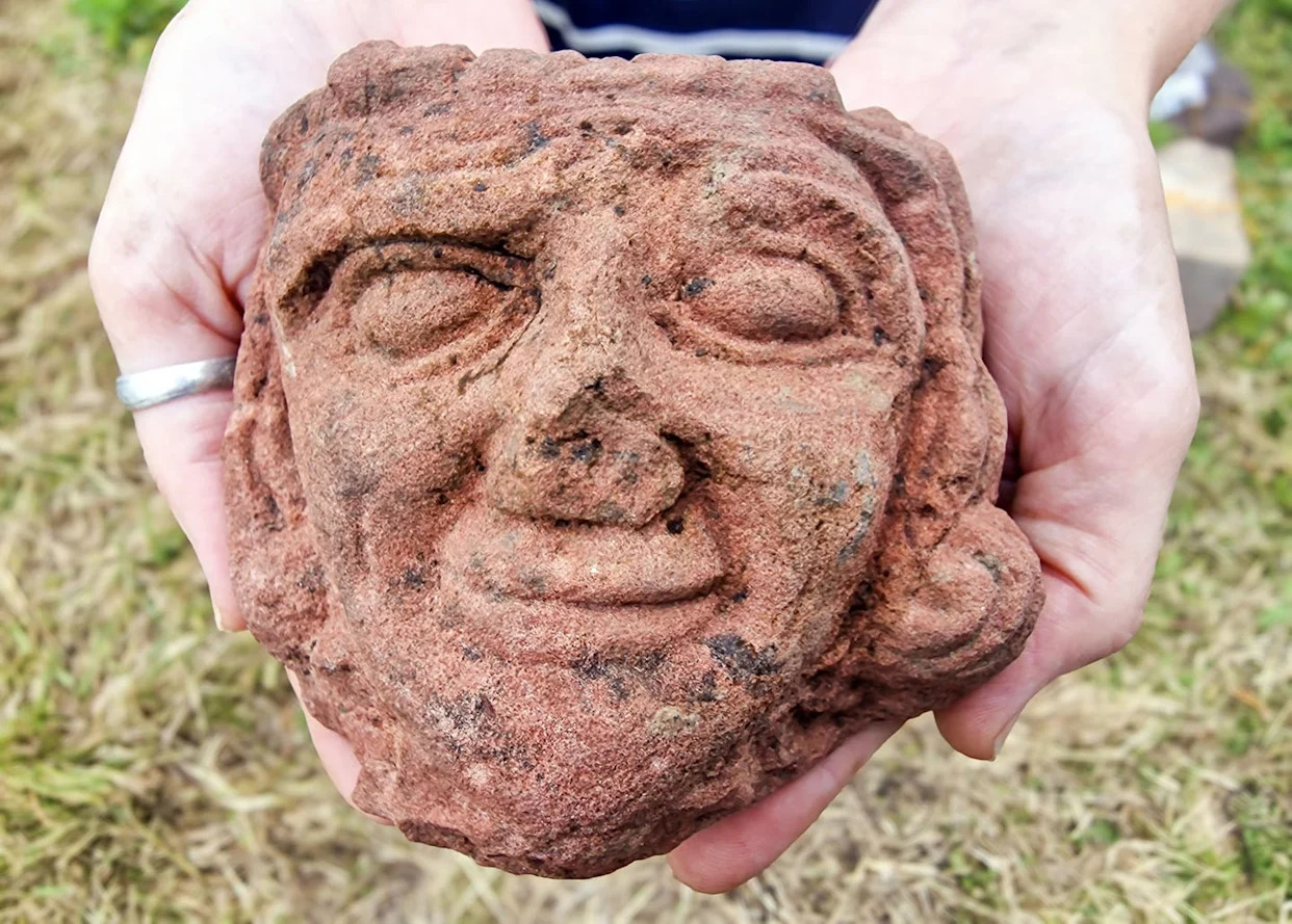 Archaeologists Dug Beneath a Farm—and Found a Smiling Ancient Face